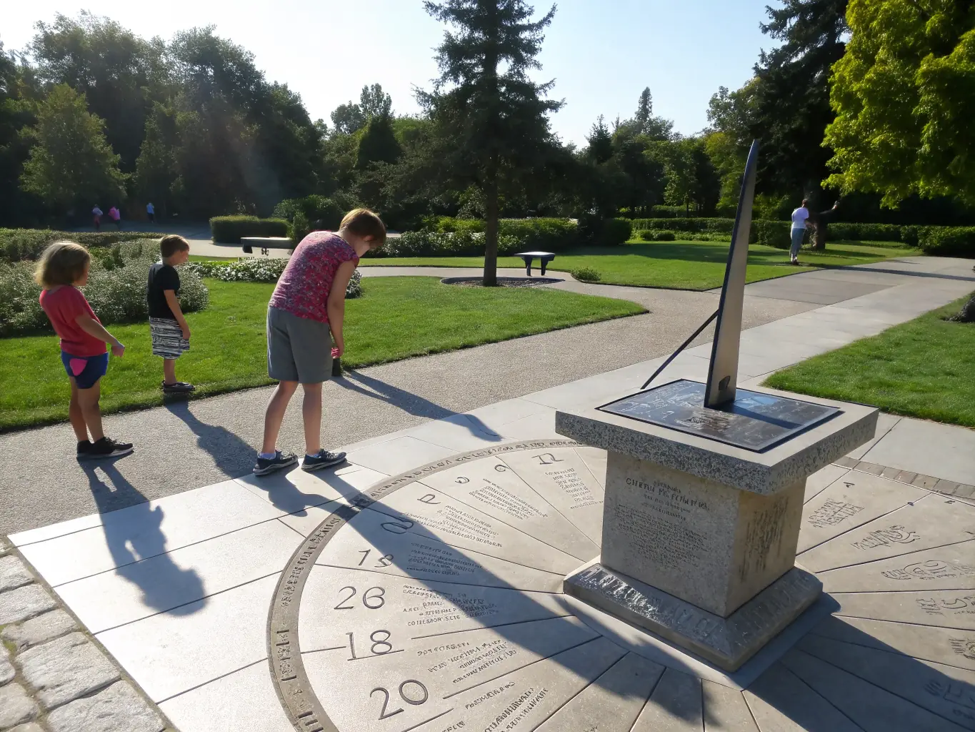A vibrant image of an outdoor exhibition showcasing various types of sundials, attracting visitors of all ages.